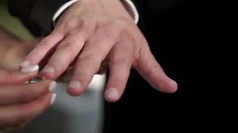 Bride and groom exchanging wedding rings Stock Footage