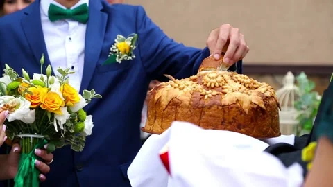 Bride and groom feed each other wedding bread Stock Footage 99051213