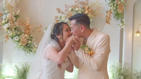 Bride and Groom Feeding Wedding Cake to Each Other at Reception Stock Footage 333379528