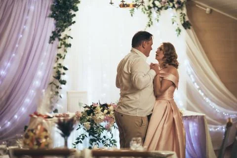 Bride and groom first dancing on background a restaurant Stock Photos