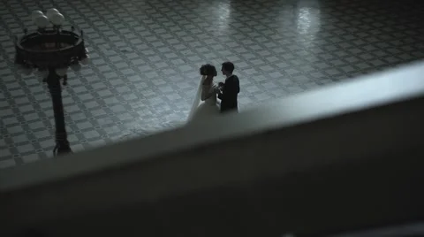 Bride And Groom In Interior Of Old Building Video stock 64413610
