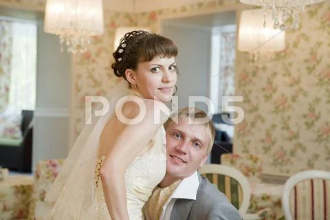 Bride and groom in interior Stock Photos