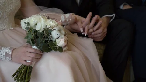 Bride and groom join hands in anticipation of the wedding ceremony 動画素材 107610573