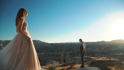 Bride and groom in the mountains of Cappadocia Stock Footage 127268053
