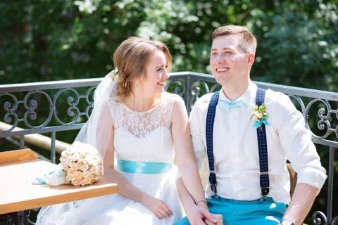 The bride and groom pose for the camera Stock Photos