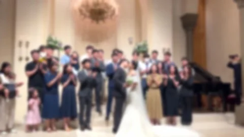 The bride and groom posing with acquaintances at the wedding Stock Footage 244618614