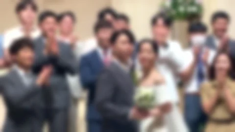 The bride and groom posing with acquaintances at the wedding Stock Footage 244618980