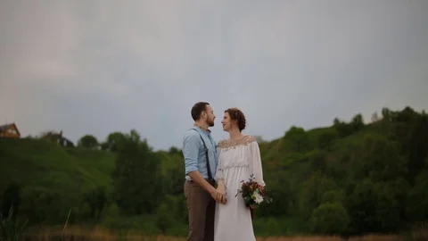 Bride and groom posing on the pier Stock Footage 77283908