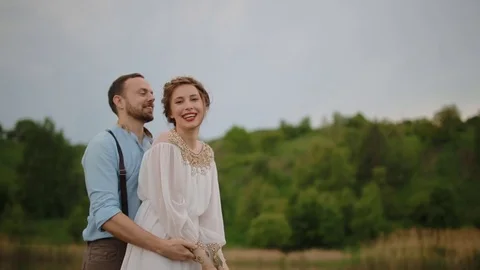 Bride and groom posing on the pier Stock Footage 77283935
