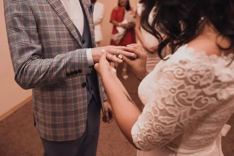 The bride and groom puts a wedding ring Stock Photos