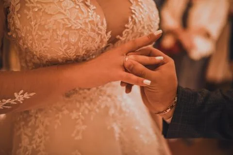 The bride and groom puts a wedding ring Stock Photos