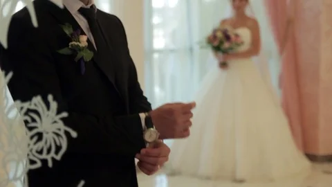 Bride and groom reflected in the mirror. Loving couple looking at each other. Stock Footage 74714407