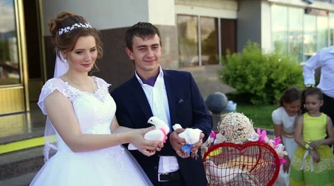 Bride and groom released white doves into the sky Stock Footage 66776445