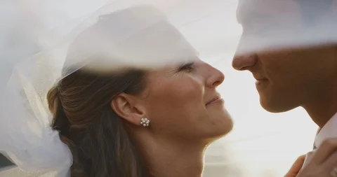 Bride and groom sharing a moment together under a veil Stock Footage 118207201