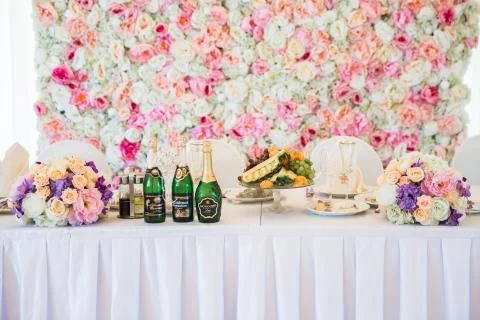 Bride and groom table serving with dishes and flowers in hall 写真素材