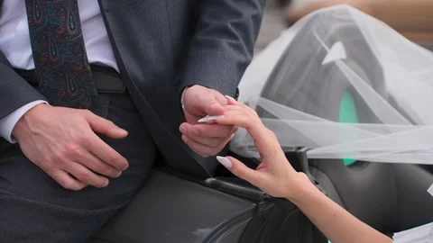 The bride and groom touch each others hands Vídeo Stock 328314921