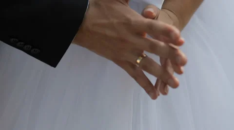 Bride and groom touch hands of each other Stock Footage 35997470