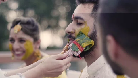 Bride And Groom With Turmeric Paste Applied On Them At Haldi Function Video stock 219921536