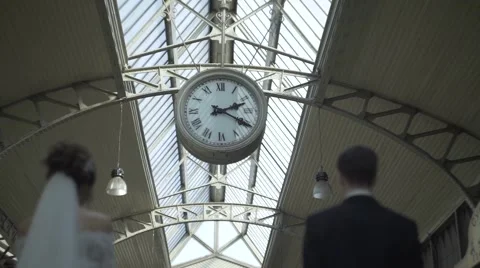 Bride And Groom Under The Clock Stock Footage 64413607