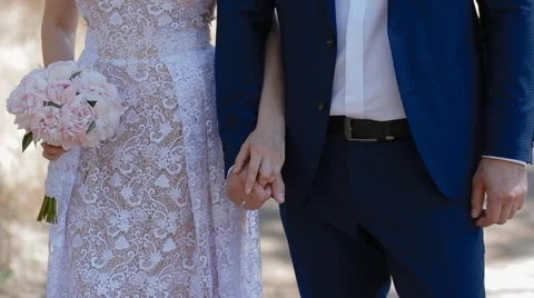 Bride and groon stand  in front of the camera Stock Footage 60210084
