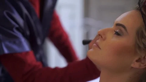 Bride Applying Wedding Makeup by Professional Make-up Artist Stock Footage 74969482