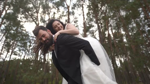 The bride on the back of the groom. Happy together Stock-Footage 305452805