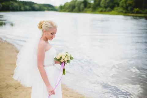 Bride on a background of the river Stock Photos