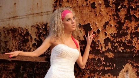 Bride On The Background Of A Rusty Iron Wall Video stock 52695707