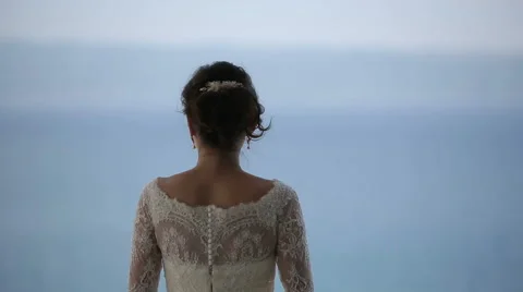The bride on a balcony of the hotel enjoy the view of Adriatic Sea Stock Footage 44563736
