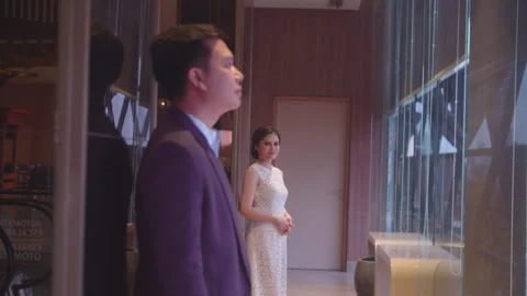 Bride to Be Looking at Her Partner near Hotel Lobby Window Stock Footage 334036622