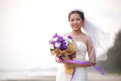 Bride at beach Stock Photos