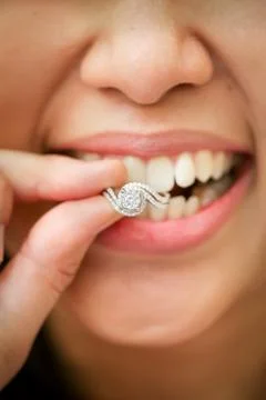 A bride biting her wedding ring. Luxury and beautiful wedding ring Stock Photos