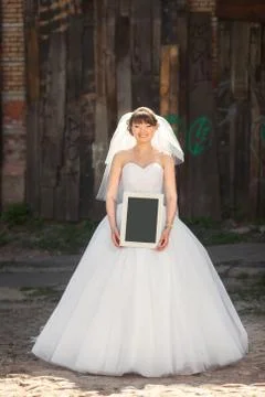 Bride with blank placard Stock Photos