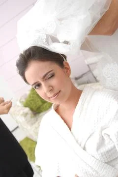 Bride blinking during preparation Stock Photos