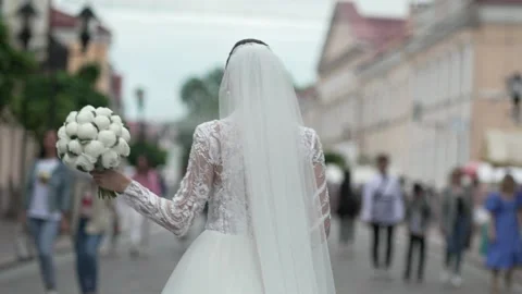 Bride with a bouquet in a stream of people Stock Footage 201252220