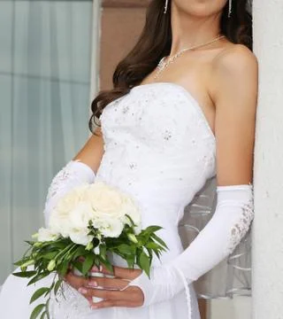 Bride with bunch of flowers Stock Photos