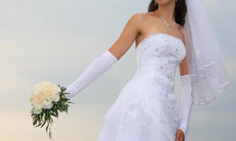 Bride with bunch of flowers Stock Photos