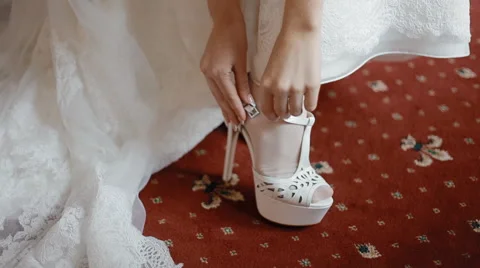 Bride button the wedding shoes Stock Footage 45274814