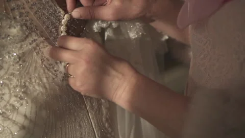 The bride is buttoned up in the morning Stock Footage 168008723