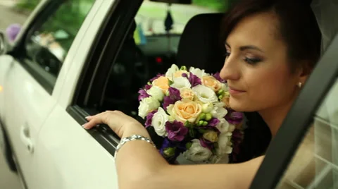 Bride in the car 1 Stock Footage 32475973