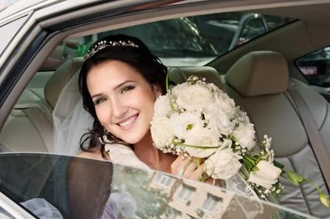 Bride in car Stock Photos