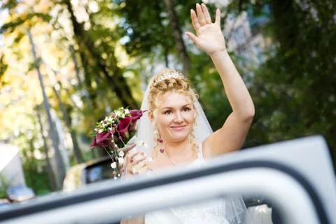 Bride by the car Stock Photos
