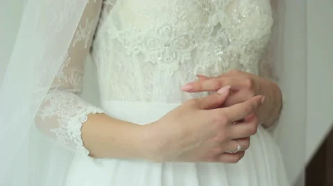 The bride is considering her ring on the wedding day Stock Footage 61926333