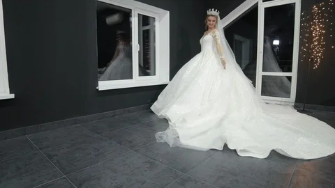 Bride crown on head chic magnificent white wedding dress that drags on ground. Stock Footage 124022944