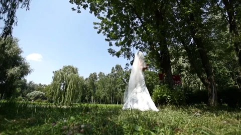 Bride is crying in the park Stock Footage 79557318
