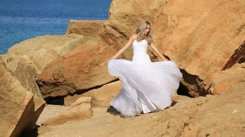 Bride dancing on the beach Stock Footage 12374370