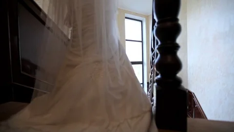 Bride descends the stairs in the hotel Stock-Footage 79657143