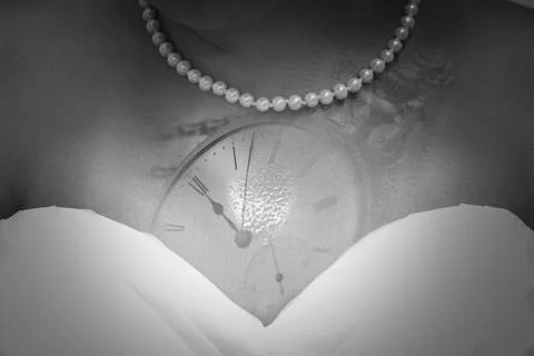 The bride with the design on a clock on her chest before the wedding Stock Photos