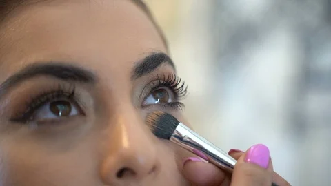 Bride doing eye makeup. close-up makeup Stock Footage 118680742
