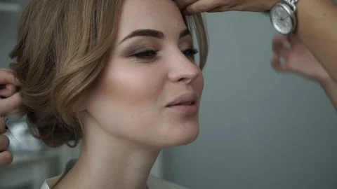 Bride doing makeup and hair style rule Stock Footage 70028904